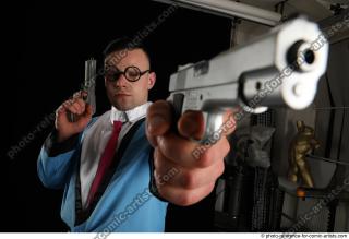 MIKAEL BLUESPY WITH TWO GUNS
